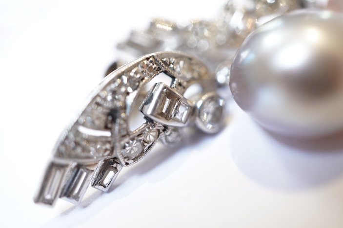 A fine pair of Art Deco natural pearl and diamond earrings, 1930s